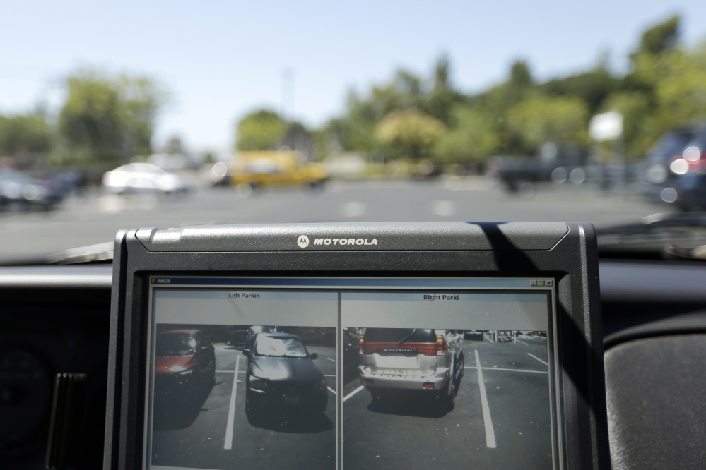 A police vehicle driven by a San Diego County deputy sheriff in San Marcos, California, shows the monitors of a license plate reader that's used to collect data on plate numbers and run that against information such as those wanted on arrest warrants. Augusta police have asked for the purchase of an automatic license plate reader that would be installed in a city police cruiser.
