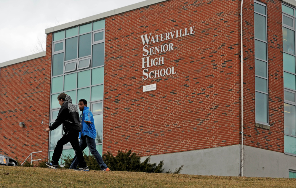 Waterville Senior High School students walk by Waterville Senior High School in March. The school was on of many in the district, as well as in Fairfield, that had a lockout for an hour on Thursday as police investigated a possible threat.