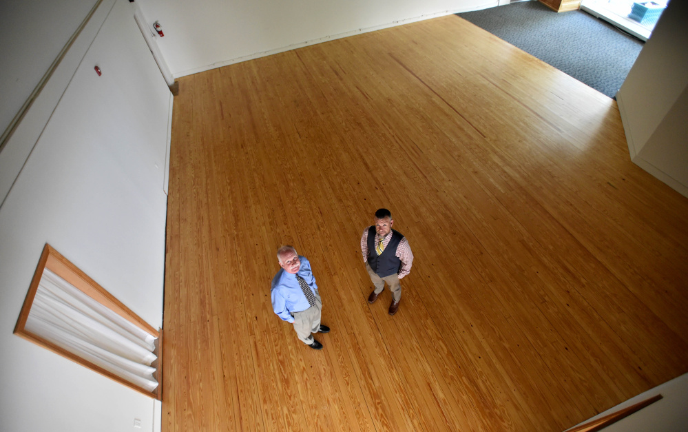 Larry Sterrs, left, chairman of the Board of Directors for Waterville Creates!, and Nathan Towne, marketing director for the organization, stand in the arts organization's newly renovated space in downtown Waterville.
