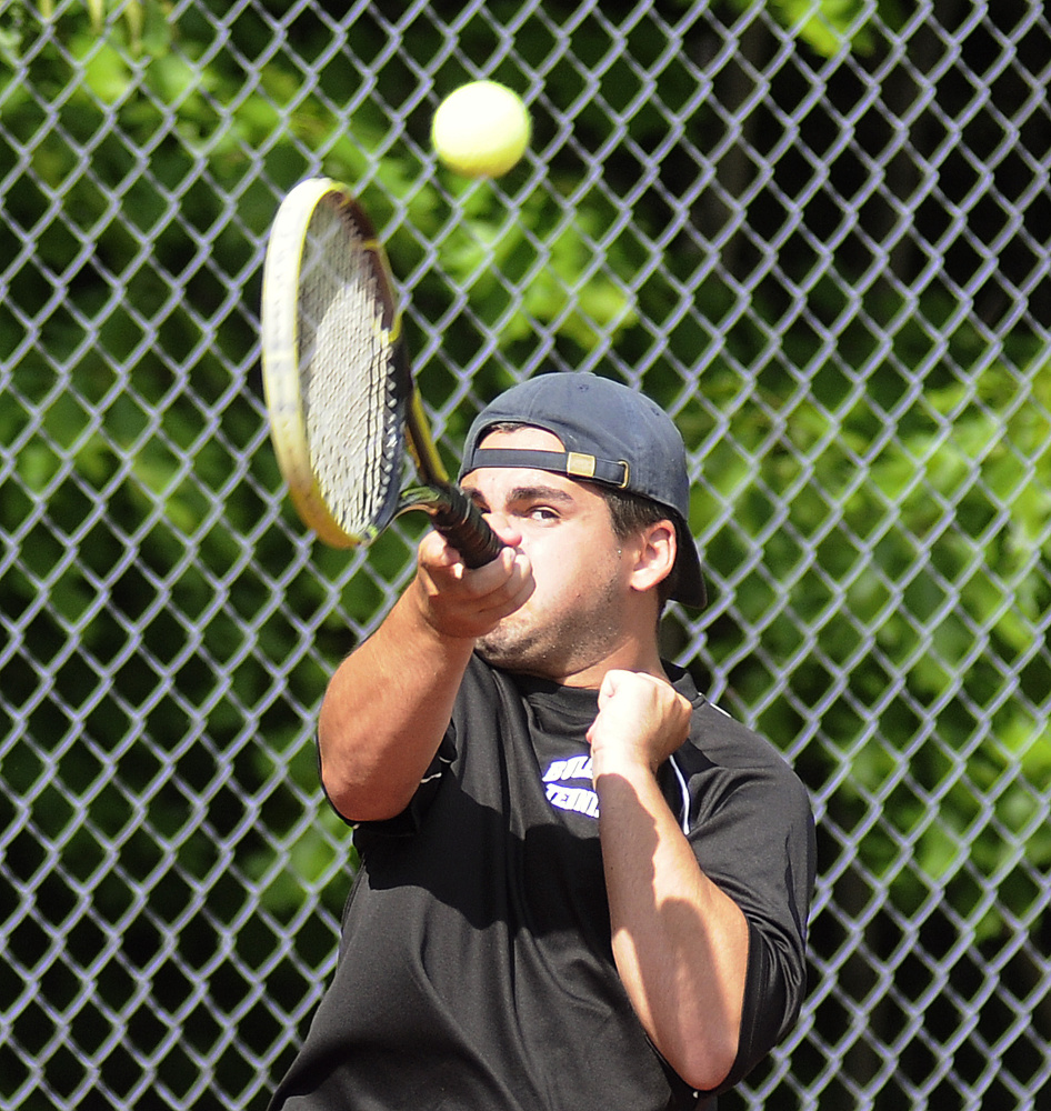 Hall-Dale High School's Alex Guiou returns a shot during a doubles match against Winthrop High School on Thursday in Farmingdale.