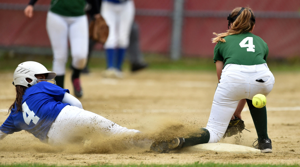 Messalonskee baserunner Kelsey Dillon (4) slides safely into second base as Oxford Hills' Kaisa Heykkenen tries to handle the ball during the Kennebec Valley Athletic Conference Class A championship game Friday.