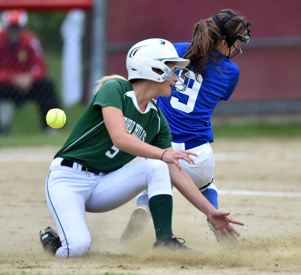 Oxford Hills' Madison Starboard slides safely into second base as Messalonskee's Madisyn Charest tries to handle the ball during the Kennebec Valley Athletic Conference Class A championship game Friday.