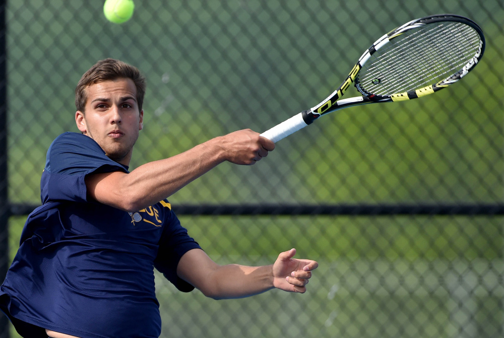 Mt. Blue's Alex Bunnell prepares to hit a shot to Mt. Arara's Joey Reed during a Class A North quarterfinal match Thursday in Farmington.