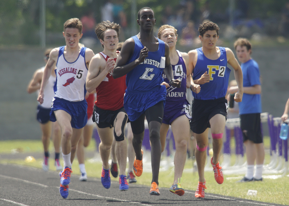 Lewiston senior Osman Doorow leads a tight pack in the final lap of the 1,60-meter run Saturday at the Class A state track and field championships at Hampden. Messalonskee junior Owen Concaugh, left, finished fourth, but not all was lost for him Saturday. Concaugh helped the 4x800 relay team to victory and also won the 800.