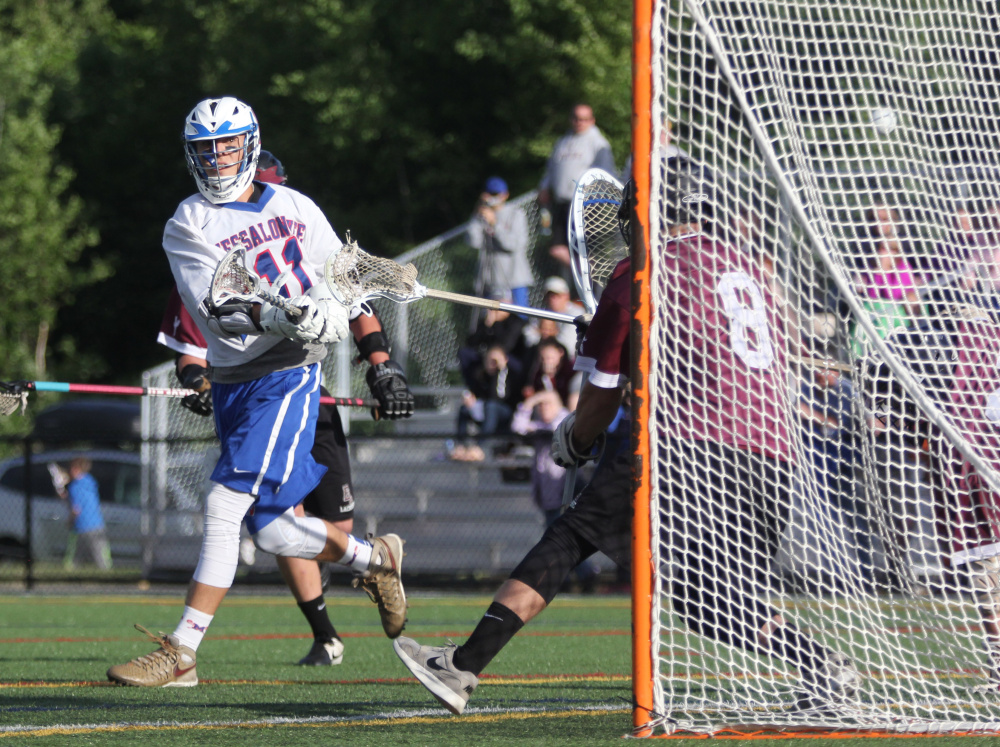 Messalonskee attacker Connor Smith scores on Edward Little goalie Brandon Asselin during a Class A North quarterfinal at Thomas College in Waterville on Wednesday.