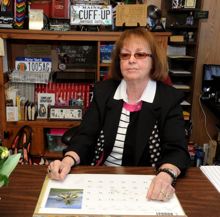 Claudia Viles, former tax collector of the town of Anson, sits at her desk Aug. 13, 2015, at the Town Office in Anson. Viles is scheduled to go on trial over allegations that she stole more than $438,000 from the Town Office.