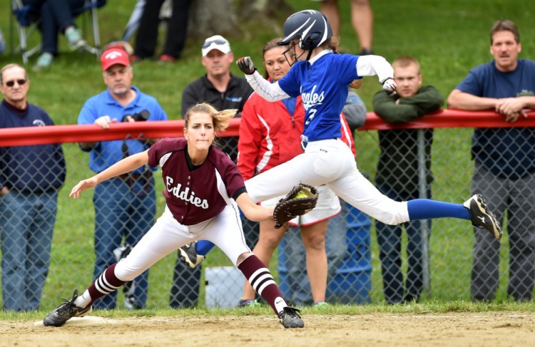 Staff photo by Michael G. Seamans 
 Messalonskee's Makenzie Charest tries to beat out the throw to Edward Little first baseman Jordan Reynolds (16) during a Class A North semifinal game Saturday in Oakland.