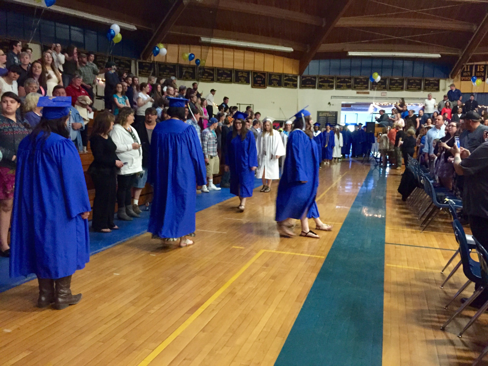 Members of the Mt. Abram High School Class of 2016 march into place Friday evening for their graduation ceremony at the school, which is in Salem Township.
