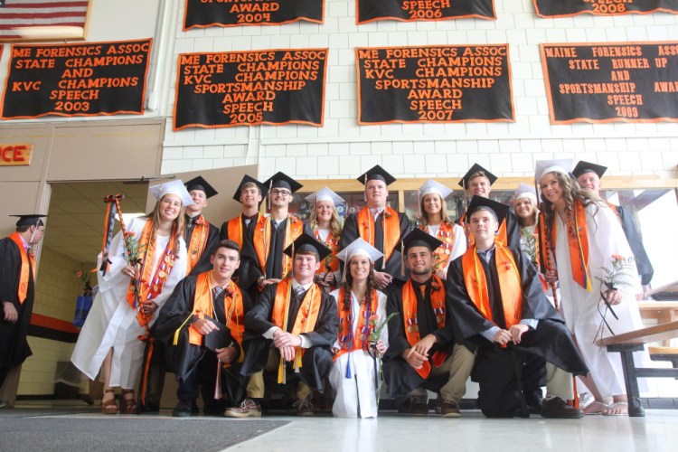 Graduating seniors stand for a photo prior to the start of commencement ceremonies at Skowhegan Area High School on Sunday.