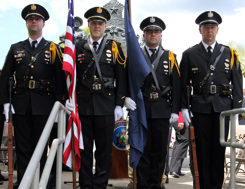 Winslow Police Honor Guard standing in front of the memorial after the ceremony. From left, are Sgt. Haley Fleming, Sgt. Brandon Lund, Officer Charles Theobald and Officer John Veilleux.