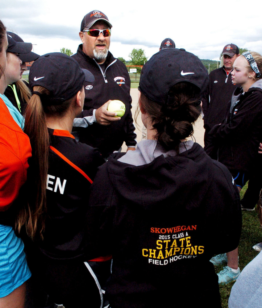 Skowhegan head softball coach Lee Johnson gives the team a talk about their upcoming Class A North regional final game Monday in Skowhegan. The No. 6 Indians will face No. 4 Edward Little at 6 tonight at Cony High School in Augusta.