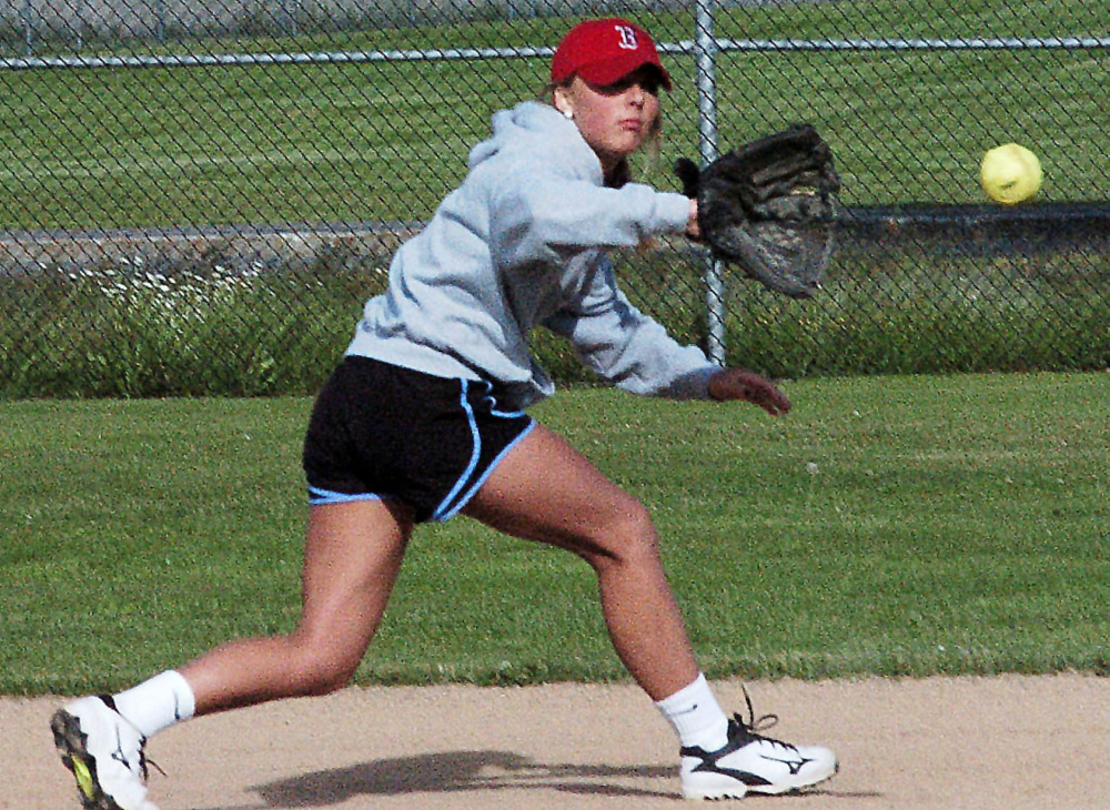 Skowhegan second baseman Eliza Bedard fields a ball during practice Monday in Skowhegan.
