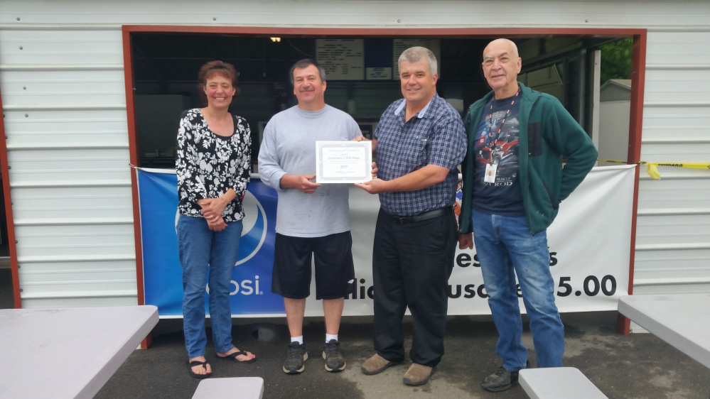 Spectrum Generations Muskie Commuity Center recently parented a Certificate of Recognition to Scott Dorval for all his hard work, dedication and community support. From left, are Angela DeRosby, Scott Dorval, Bob Marin and Roger Derosier.
