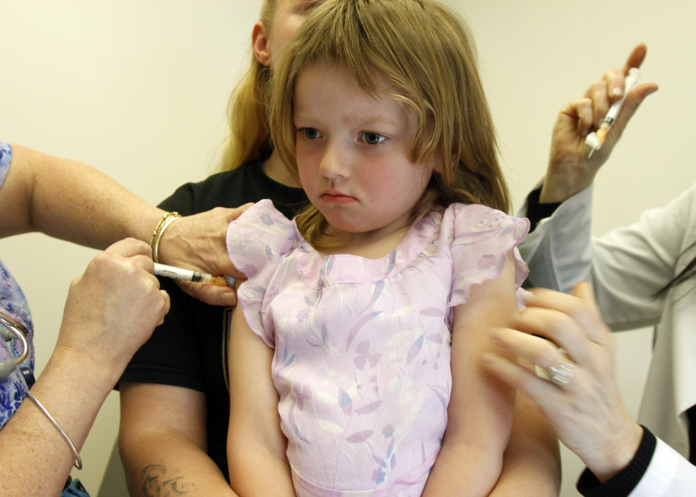Holly Ann Haley gets vaccinations at the doctor's office in Berlin, Vt., in 2012. Maine is among the most lenient states in the country fpr