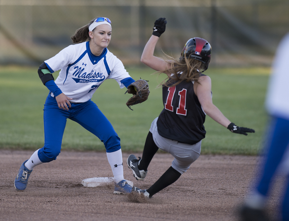 Madison's Kayla Bess tags out Lisbon runner Kipri Steele during first inning action of the Class C South championship game Tuesday night at St. Joseph's College.