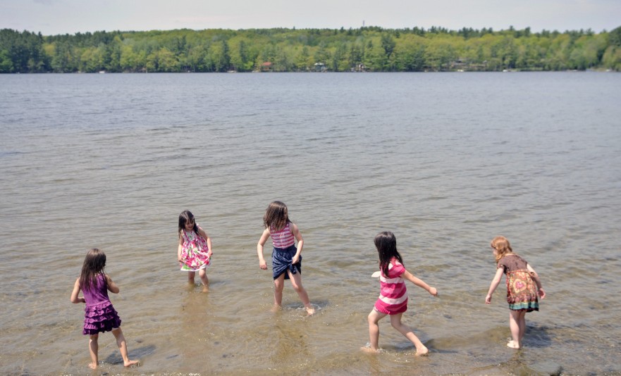 Children play in May 2016 at the town beach on Cochnewagon Lake in Monmouth, where voters on Tuesday approved spending money to improve the lake's water quality.