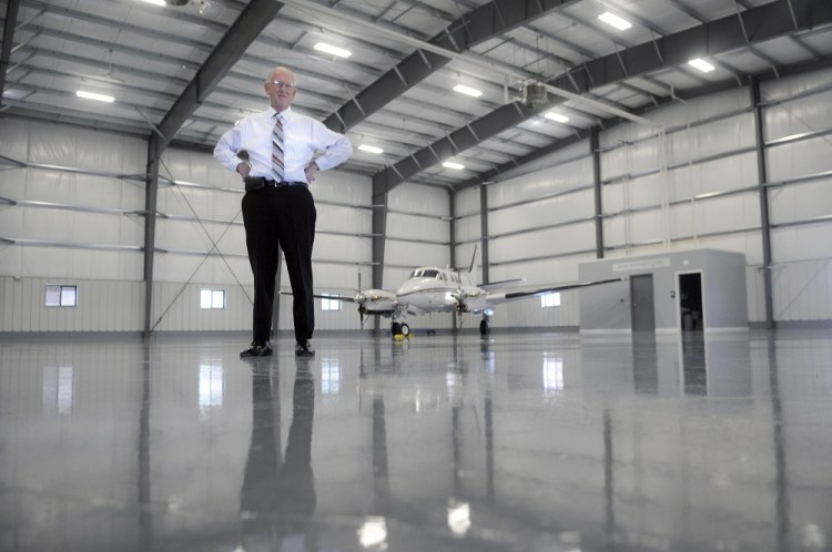 William H. Perry, a proprietor of Maine Instrument Flight, stands on Thursday in the new corporate hangar at the firm's headquarters in Augusta. The firm stores its KingAir charter plane in the state-of-the-art hangar, which also will host corporate and private jets.