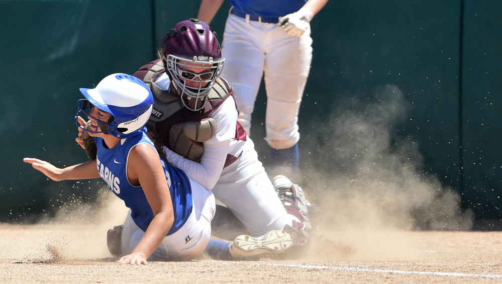 Richmond catcher Sydney Tilton can't hold on to the ball as Stearns runner Cassidy McLeod slides safely across home plate during the Class D state title game Saturday in Brewer.