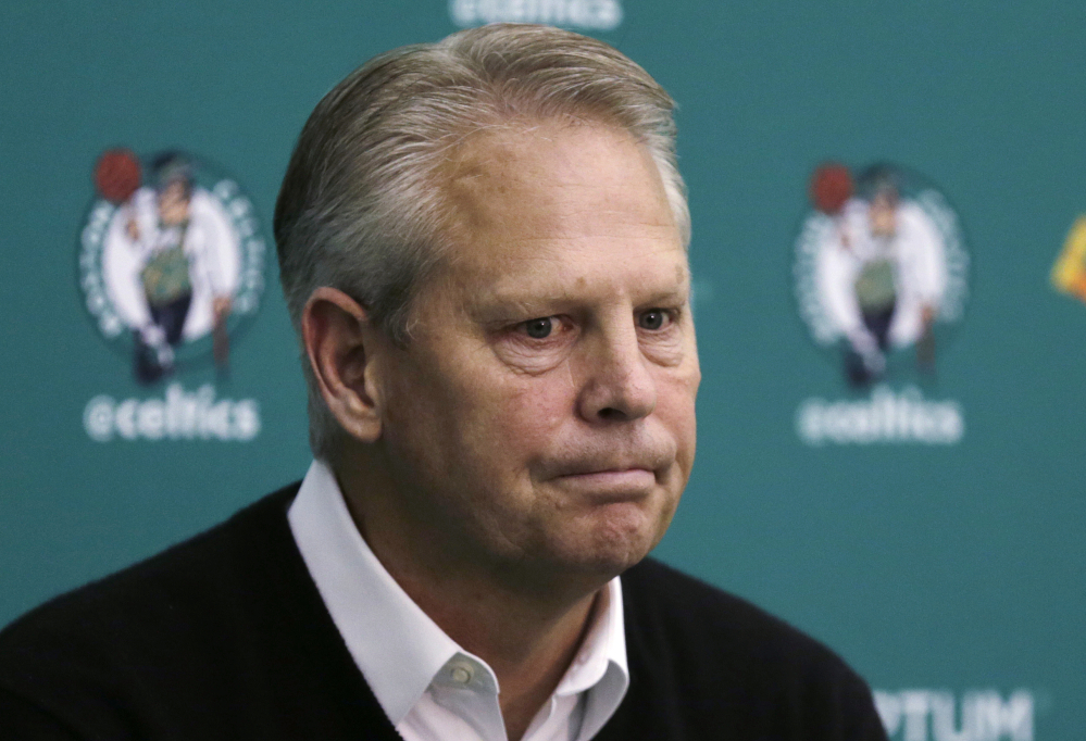 Boston Celtics President of Basketball Operations Danny Ainge pauses while answering a reporter's question at the basketball team's training facility in Waltham, Massachusetts.  Ainge became a marvel among his fellow league executives in 2007 when he pulled together the mega deal that would become Boston's Big Three and subsequent NBA championship. With eight picks to play with entering Thursday, June 23 draft, Ainge again finds himself in a unique spotlight, and bargaining position, as the Celtics look to use the draft to transform into a player again in the Eastern Conference.