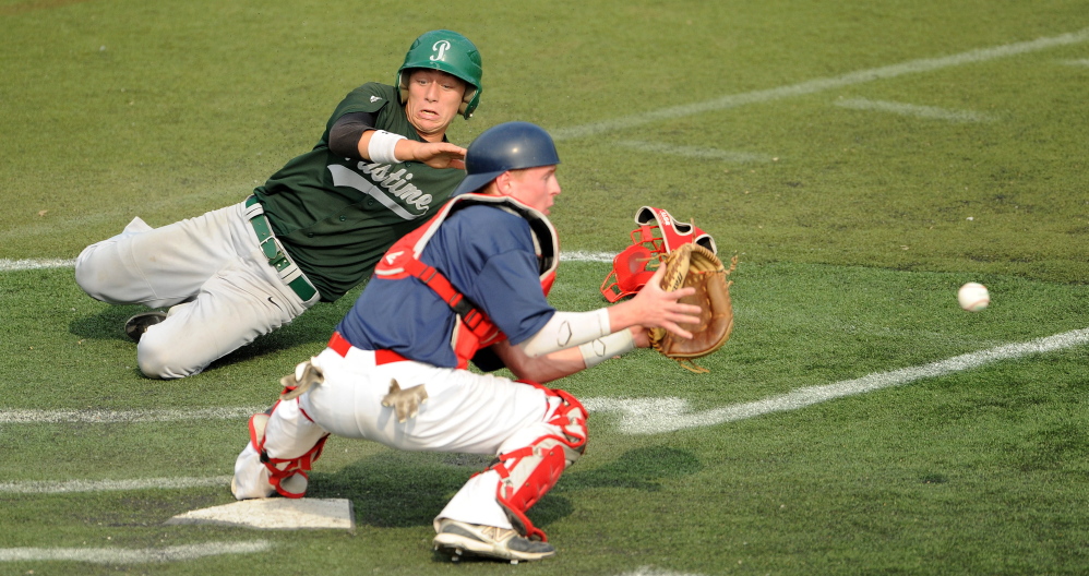 Post 51 cather Trevor Gettig waits for the ball as Lewiston Pastime's Caleb Dostie slides home during a 2014 state tournament game at Husson University in Bangor.
