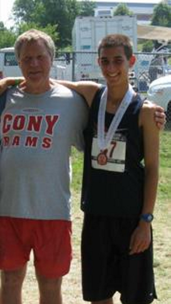 Coach Taylor Harmon poses with former Cony student-athlete Luke Fontaine.