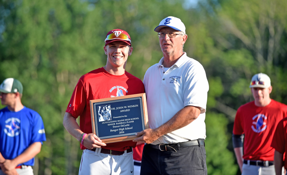 Lars Jonassen, right, presents the Dr. John Winkin Award to Bangor High School's Trevor DeLaite, with award finalists in the background, before the Class A/B All-Star game Friday at Colby College in Waterville.
