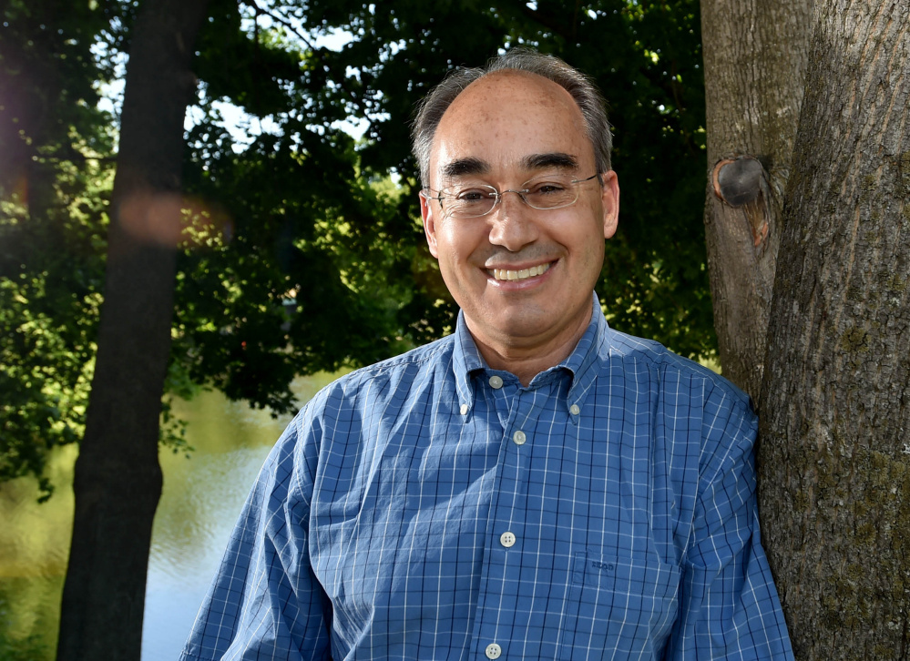 Rep. Bruce Poliqiun poses for a portrait Saturday on the banks of Messalonskee Lake in Oakland.