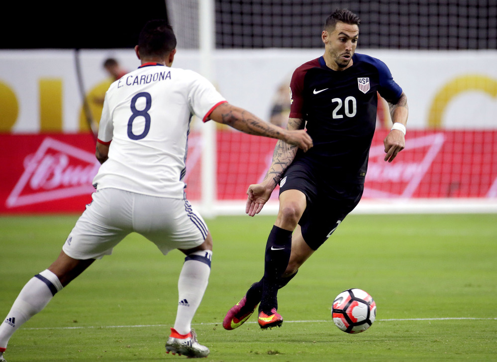 United States defender Geoff Cameron (20) is defended by Colombia midfielder Edwin Cardona (8) during the Copa America Centenario third-place soccer match at University of Phoenix Stadium on Saturday in Glendale, Arizona.
