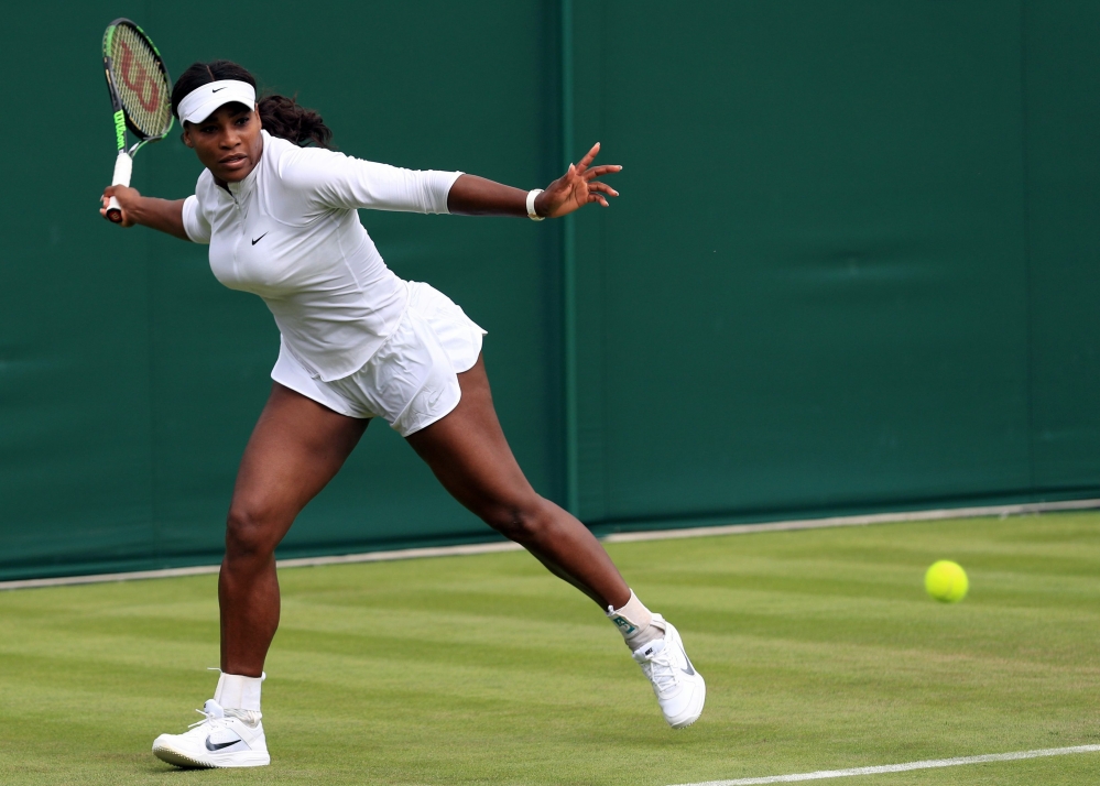 Serena Williams practices during a preview day for Wimbledon at the The All England Lawn Tennis and Croquet Club on Saturday in London. Wimbledon begins today.