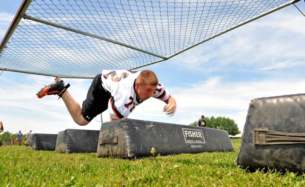 Skowhegan lineman Dan Laweryson competes in the obstacle course during the annual Big Man competition at Skowhegan Area High School on June 28, 2014.
