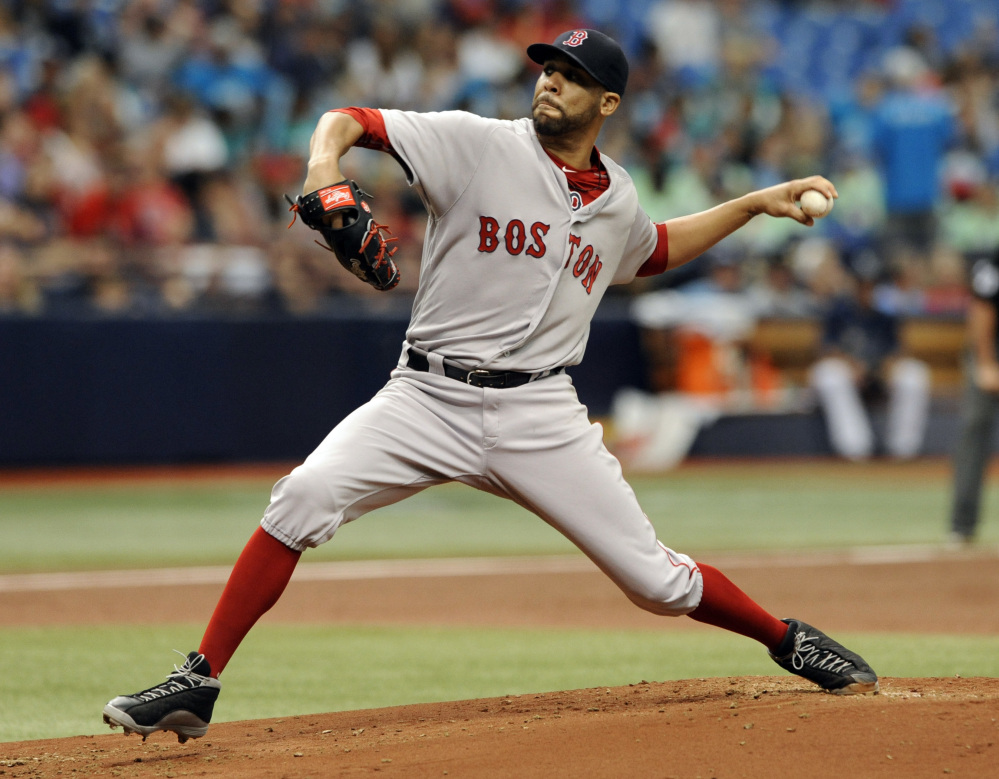 Boston Red Sox starter David Price pitches against the Tampa Bay Rays during the first inning Wednesday in St. Petersburg, Florida.