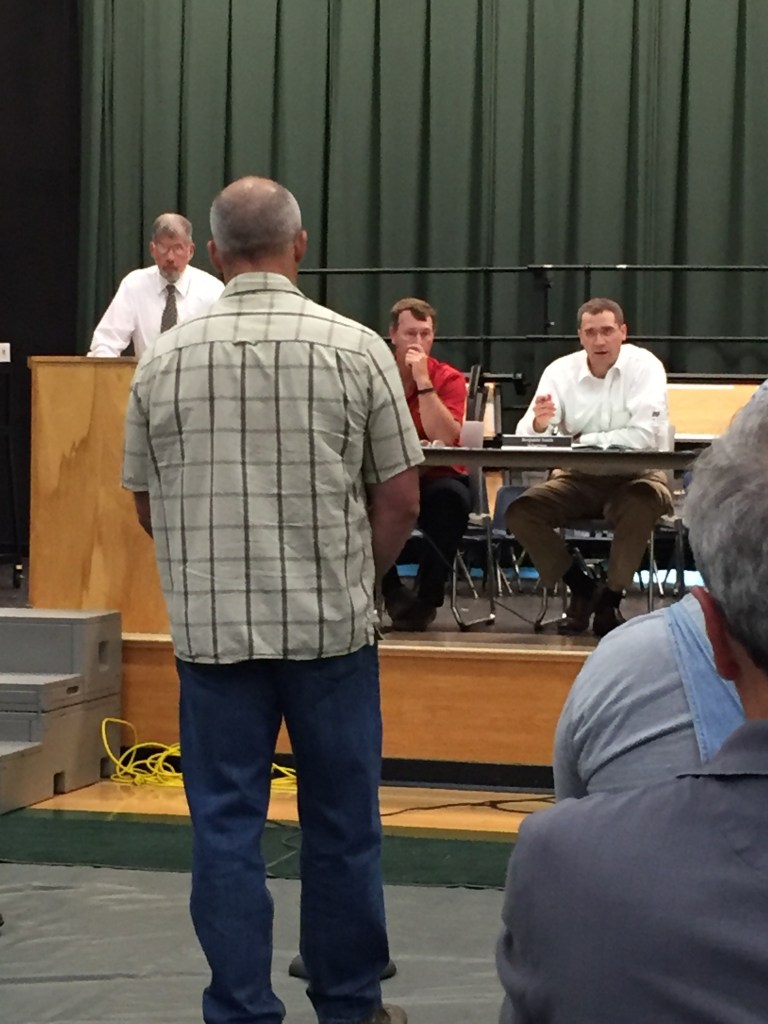Chelsea Selectman Benjamin Smith answers a resident's question on a proposal to fund a part-time constable at Town Meeting on Thursday night.
