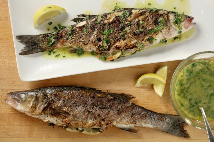 For the herb-grilled Mediterranean sea bass recipe, the fish are drizzled after grilling with a lemon, ginger and chive finishing sauce.