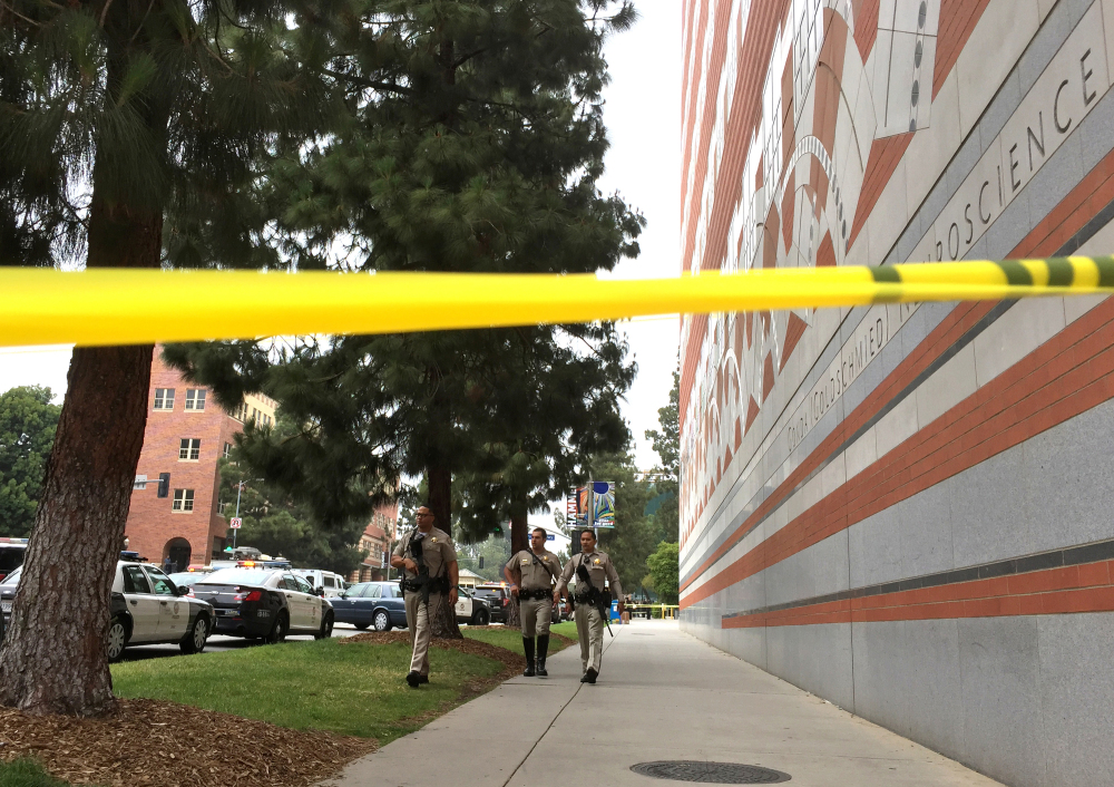 Sheriff deputies work at the scene of a fatal shooting at the University of California, Los Angeles, on Wednesday.
