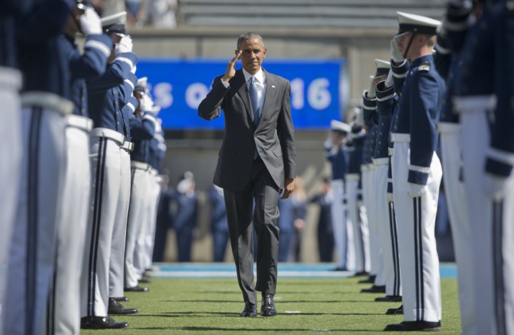 President Obama returns a salute as he arrives to deliver his final commencement address as president to the 2016 class at the U.S. Air Force Academy on Thursday in Colorado Springs, Colo.