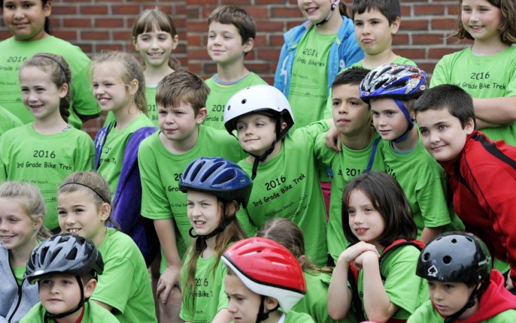 Third-graders gather for a group photo before they head out on the Henry L. Cottrell School’s annual bike ride to a beach in Monmouth in late May. 


Shawn Patrick Ouellette/
Staff Photographer
