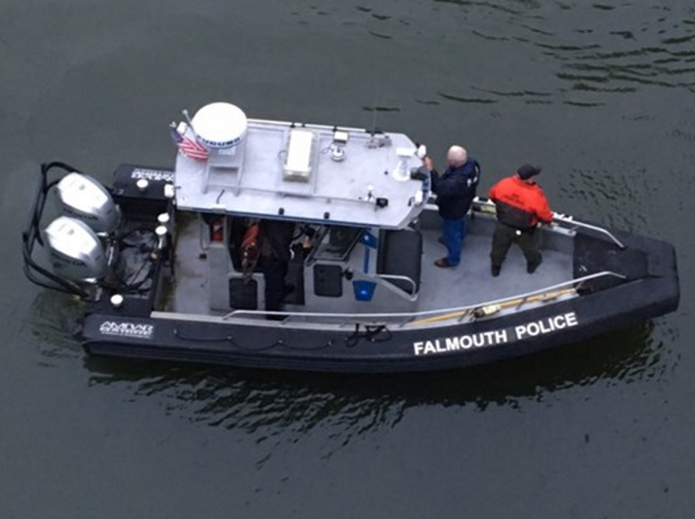 Police search the Presumpscot River in Falmouth on Thursday for a missing teenager. The search was to resume early Friday.