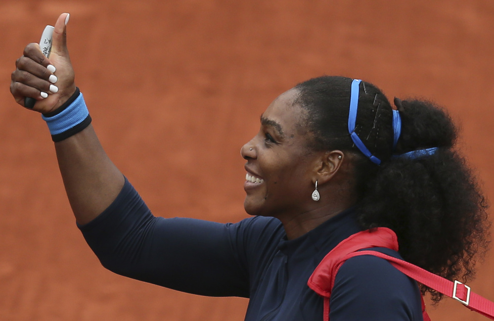 Serena Williams celebrates after defeating Kazakhstan's Yulia Putintseva 5-7, 6-4, 6-1, in the quarterfinals of the French Open. Williams is seeking a 22nd Grand Slam title, which would tie the modern record.
