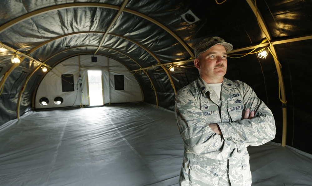 Washington Air National Guard Lt. Col. Curt Puckett stands in a temporary living structure his soldiers helped assemble for an earthquake readiness drill.