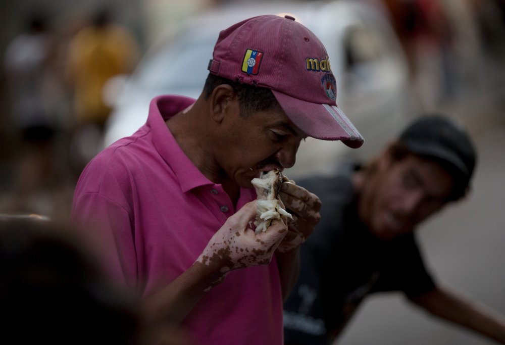 Venezuelans who once considered themselves middle class now rummage through garbage for rotten fruit and vegetables as an economic crisis engulfs the country.