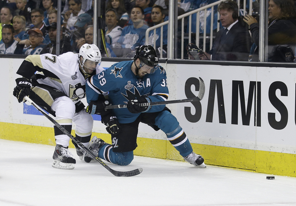 San Jose center Logan Couture, right, battles Pittsburgh center Matt Cullen for the puck during Game 3 of the Stanley Cup Finals. Couture has four three-point games in the postseason, including San Jose's series-prolonging win in Game 5.