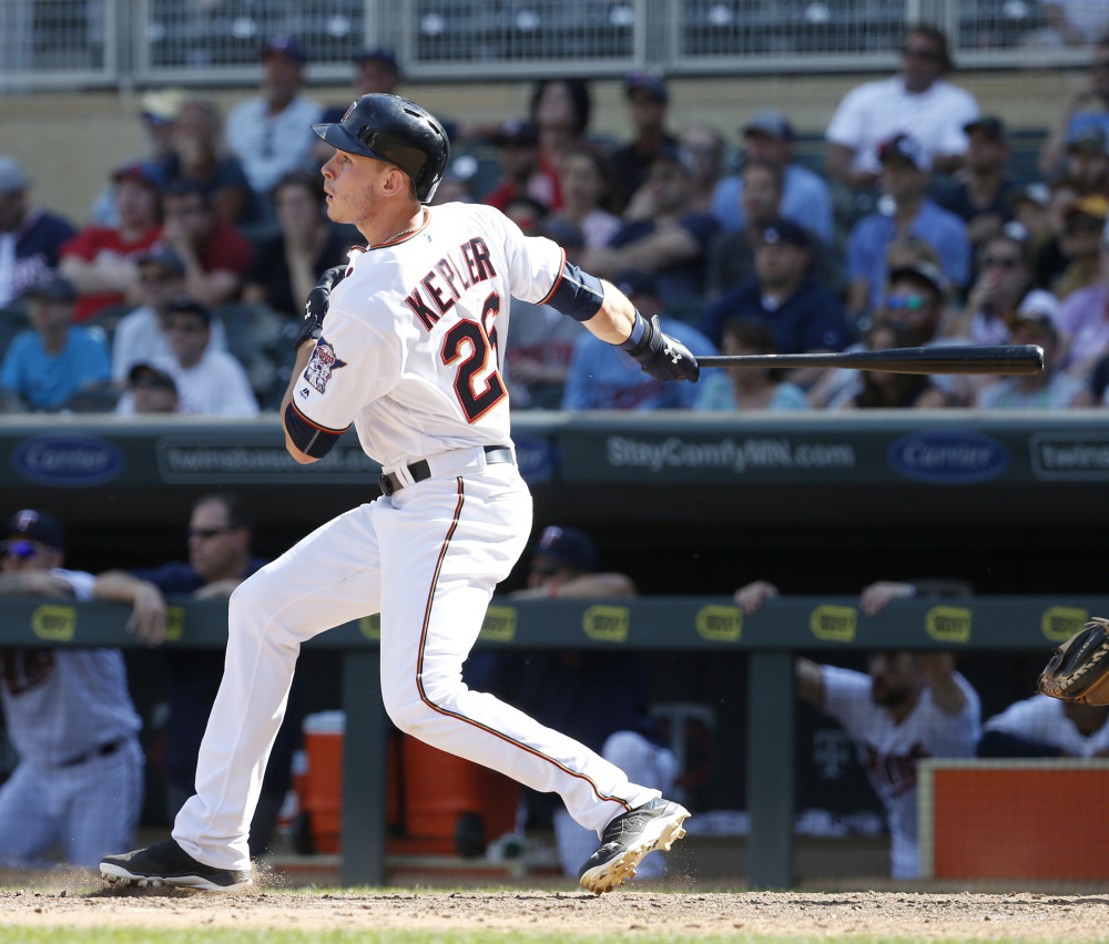 Minnesota's Max Kepler hits a three-run home run in the bottom of the 10th inning off Boston reliever Matt Barnes to give the Twins a 7-4 win Sunday in Minneapolis.