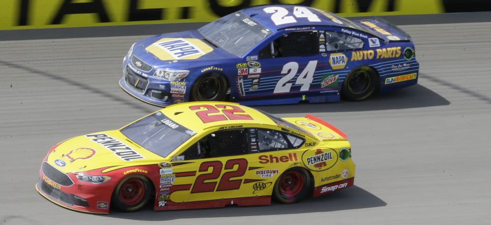 Joey Logano, bottom, pulled away from 20-year-old Chase Elliott, top, to win the Sprint Cup race Sunday at Michigan International Speedway. Logano, Elliott and Kyle Larson set a NASCAR record as the youngest top three in Sprint Cup history.