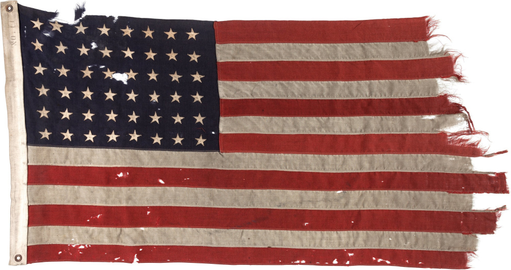 A 48-star U.S. flag flown on the stern of the guide boat that led the first American troops onto Utah Beach on D-Day appears in photo provided by Heritage Auctions.