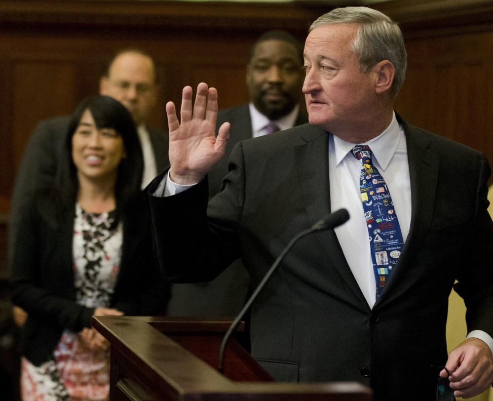 Mayor Jim Kenney walks to the podium for a news conference Thursday at City Hall in Philadelphia, which became the first major American city with a soda tax.