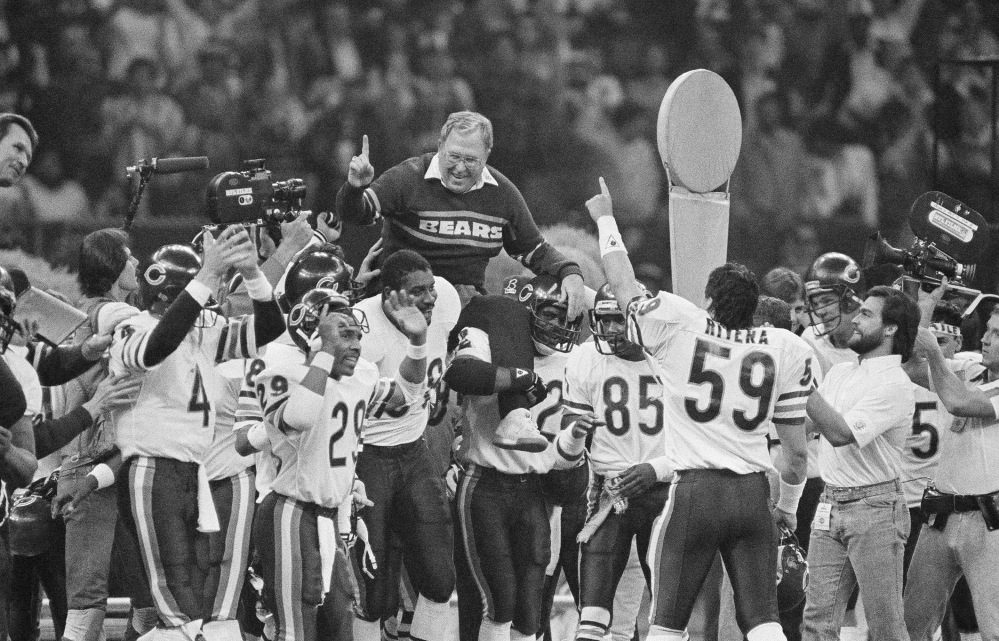 Chicago Bears defensive coordinator Buddy Ryan is carried off the field by the team after the Bears beat the New England Patriots 46-10 in Super Bowl XX in New Orleans.