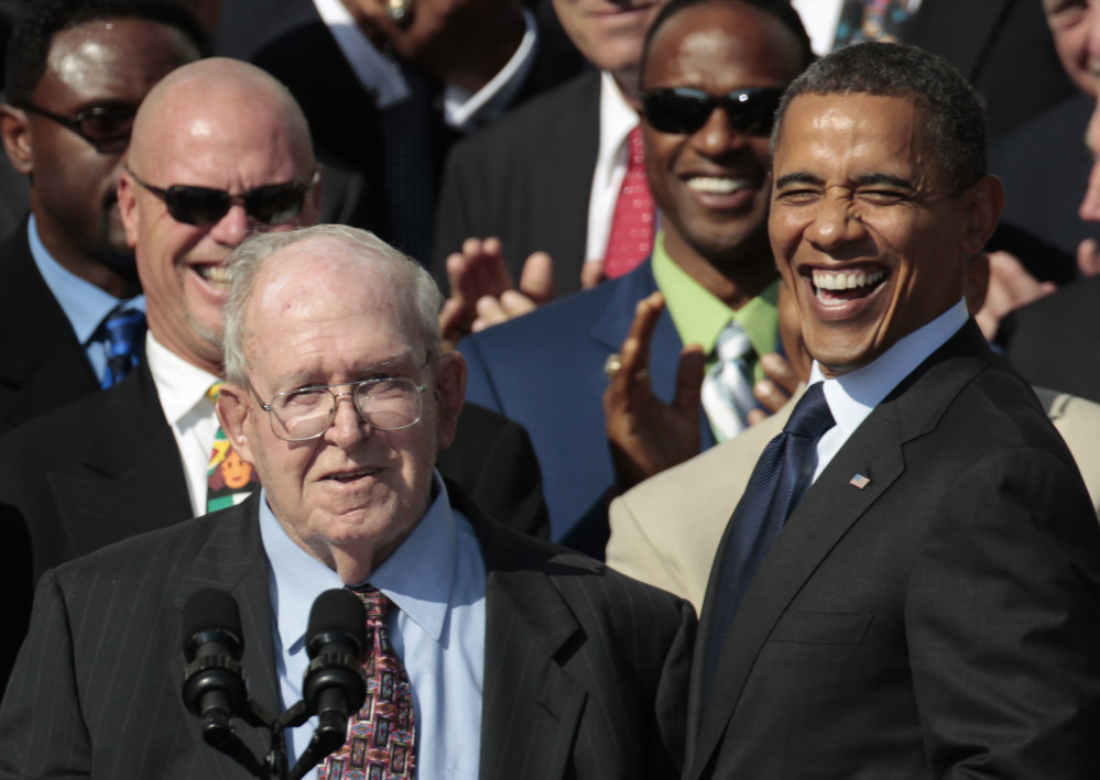 President Barack Obama, right, smiles at former defensive coordinator Buddy Ryan, speaking left, as he stands with the 1985 Super Bowl XX Champions Chicago Bears football team during a ceremony on the South Lawn of the White House in Washington. Buddy Ryan, who coached two defenses that won Super Bowl titles and whose twin sons Rex and Rob have been successful NFL coaches, died Tuesday, June 28, 2016. He was 82. (AP Photo/Pablo Martinez Monsivais, File)