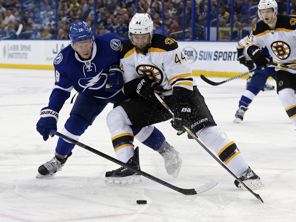 Boston defenseman Dennis Seidenberg, shown in a March 2015 game battling Tampa Bay's Ondrej Palat, was let go by the Bruins on Thursday.