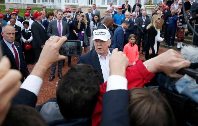 The presumptive Republican presidential nominee  Donald Trump  speaks after he arrived by helicopter at his revamped Trump Turnberry golf course in Turnberry Scotland Friday June 24, 2016. Trump saluting the United Kingdom's vote to leave the European Union, saying "they took back their country, it's a great thing." Trump arrived at his Turnberry golf course in Scotland a day after the so-called Brexit vote. (Andrew Milligan/PA via AP)