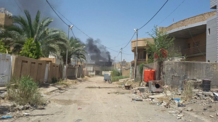 Smoke rises from a neighborhood in central Fallujah as Iraqi counterterrorism forces battle Islamic State militants in the southern part of the city on Tuesday. The elite troops repelled a four-hour attack by the Islamic State group. The Associated Press